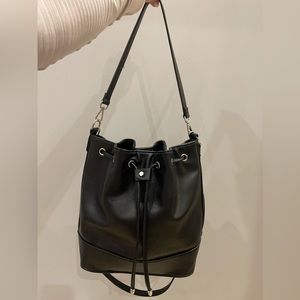 Black leather bucket bag. Like new only wore it once. Silver hardware.
